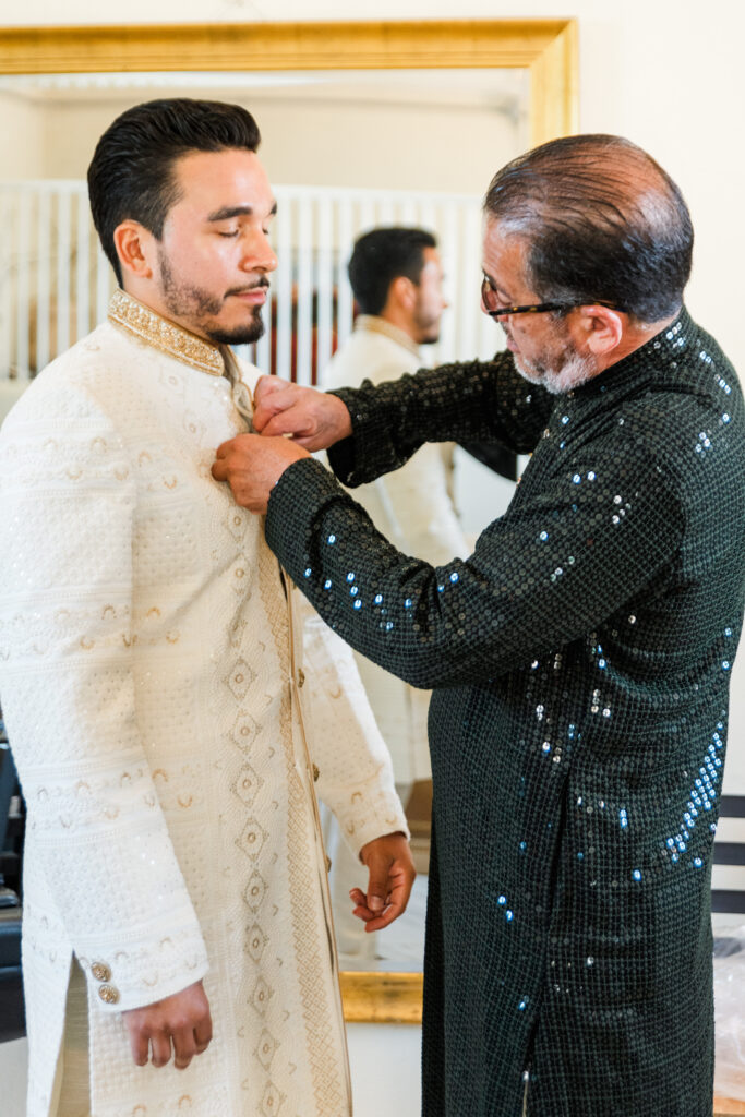 Groom and his father share a moment while getting ready for the wedding day at Lauxmont Farms. 