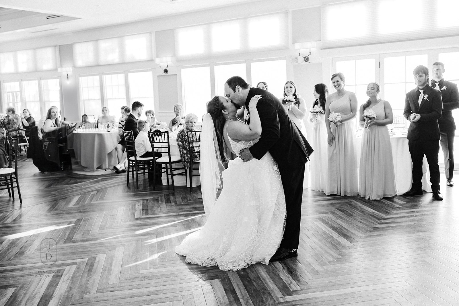 Bride and groom making their grand entrance at a wedding reception in Maryland, celebrating with guests during an elegant reception.
